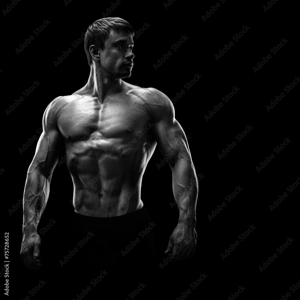 Stunning muscular young men bodybuilder looking behind