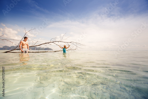 young happy asian couple on island