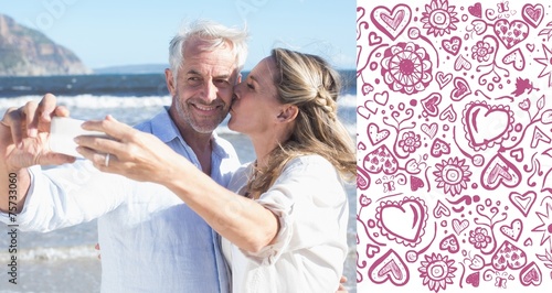 Married couple at the beach together taking a selfie