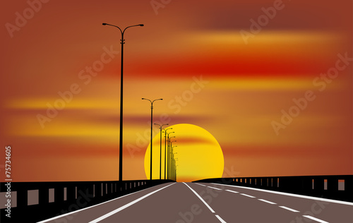 grey straight road at orange sunset