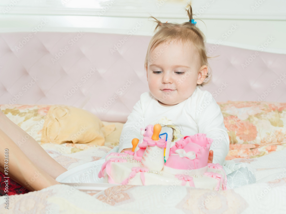 Small caucasian child girl on happy birthday with cake at home Small caucasian child girl on happy birthday with cake at home
