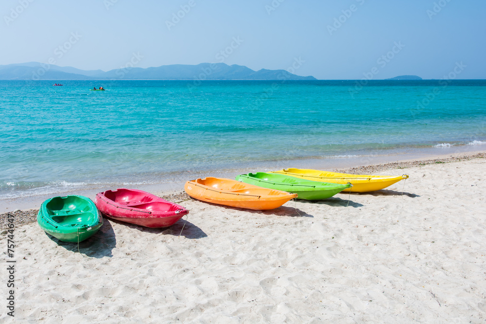 Colorful kayak on tropical beach Colorful kayak on tropical beach