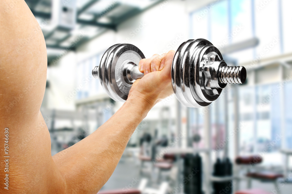 gym. man with dumbbell in the hand gym. man with dumbbell in the hand