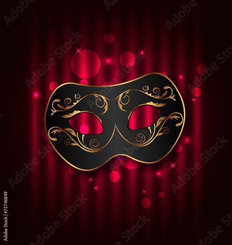 Black carnival ornate  mask on glowing background