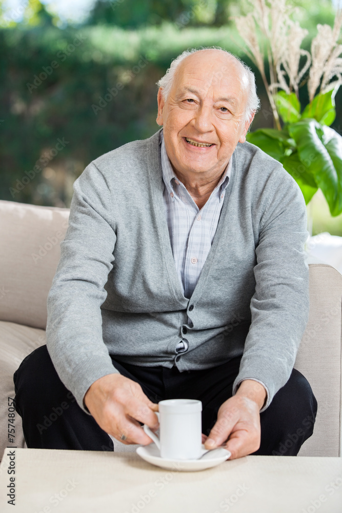 Senior Man Having Coffee At Nursing Home Porch Senior Man Having Coffee At Nursing Home Porch