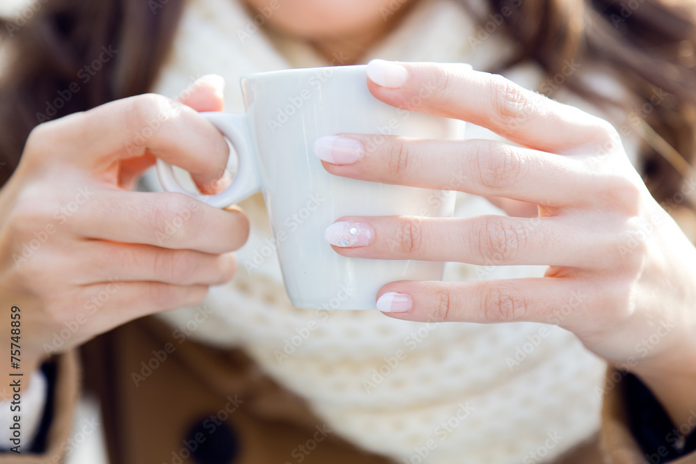 Portrait of young beautiful woman drinking coffee outdoor. Portrait of young beautiful woman drinking coffee outdoor.
