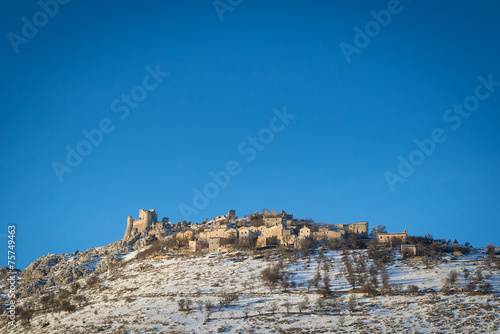 Panoramic view of Rocca Calascio in winter time with blue sky. A