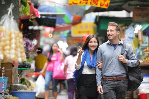 Tourists shopping in street market in Hong Kong