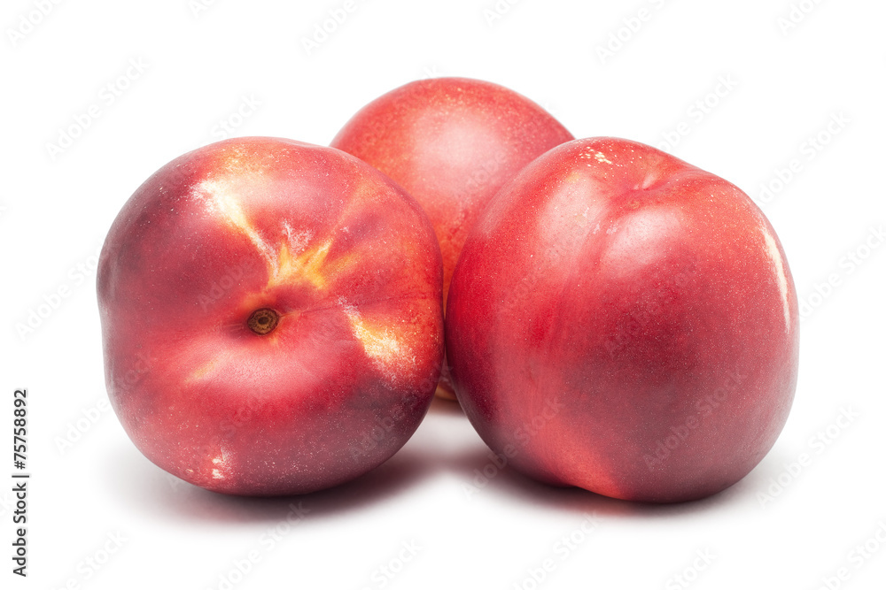 three ripe nectarines isolated on white background