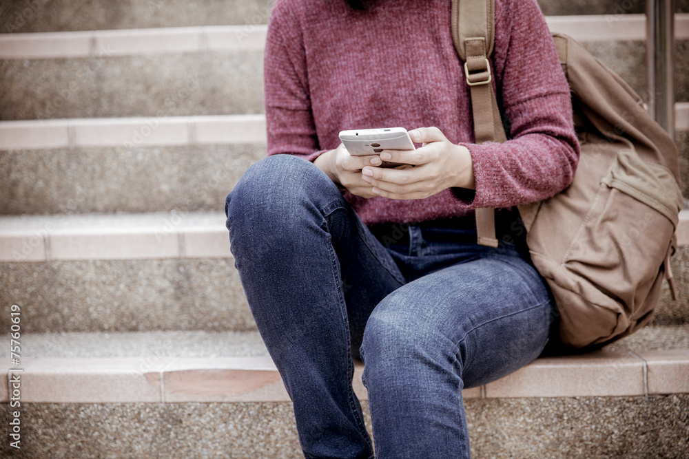 attractive female college student sitting on stairs attractive female college student sitting on stairs