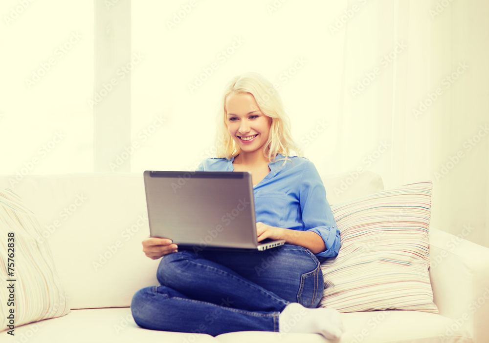 smiling woman with laptop computer at home smiling woman with laptop computer at home