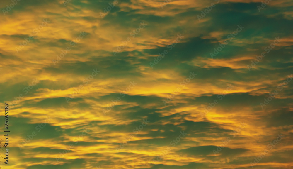 Impressive yellow and green cloudscape in the evening