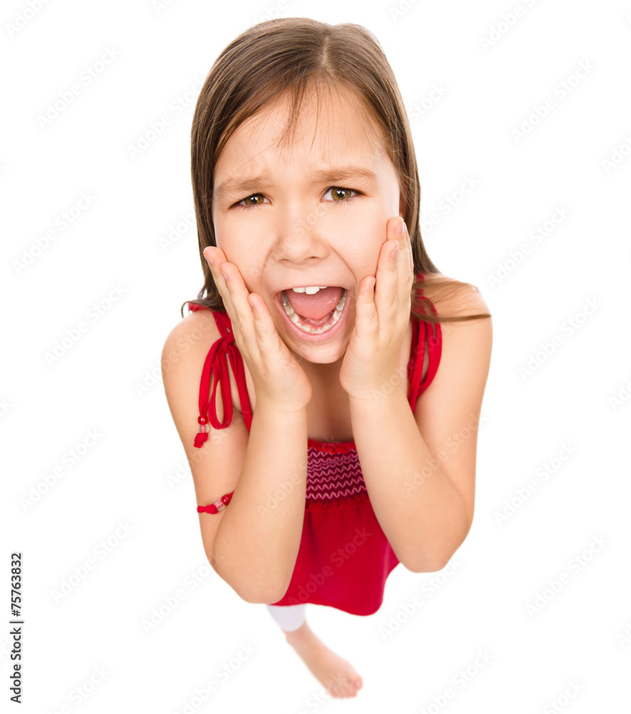 Fototapeta premium Little girl is holding her face in astonishment