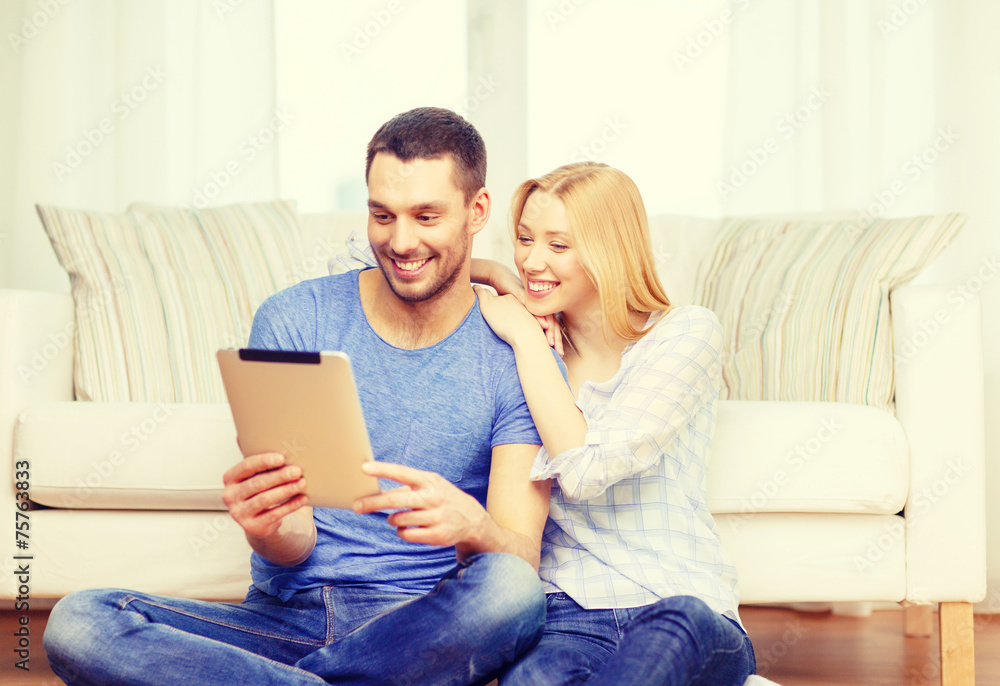 smiling happy couple with tablet pc at home smiling happy couple with tablet pc at home