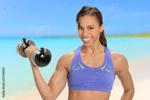 African Amerian Woman Using Dumbbell
