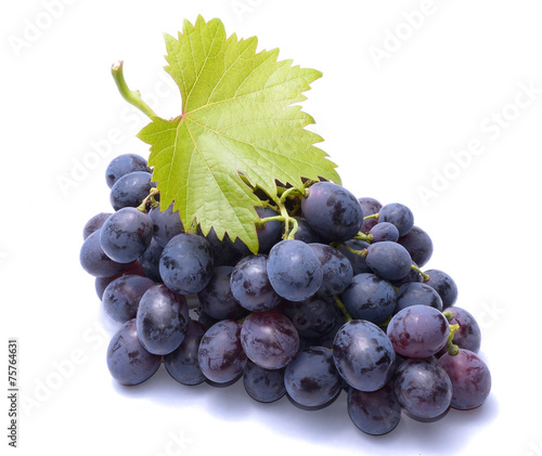 Red grapes with leaves isolated on white background