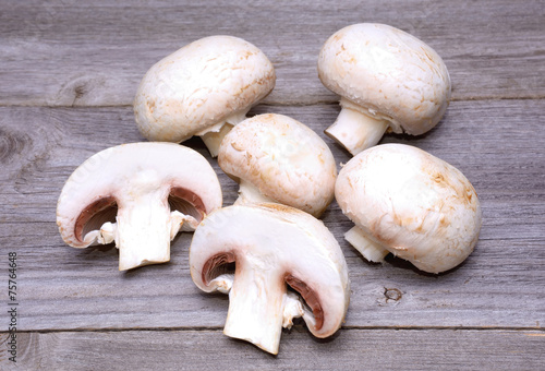 Champignon on wooden background