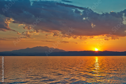 Sunset over the Greece  waves from the ferry  and the