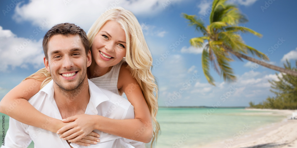 happy couple having fun over beach background