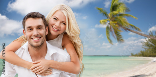 happy couple having fun over beach background