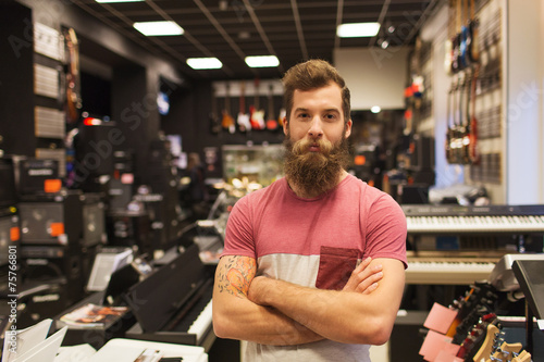 Photo assistant or customer with beard at music store