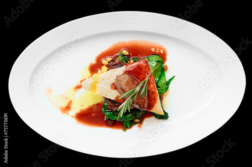 Tenderloin steak with beef terrine and spinach, isolated