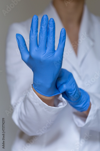 Nurse wearing protective gloves