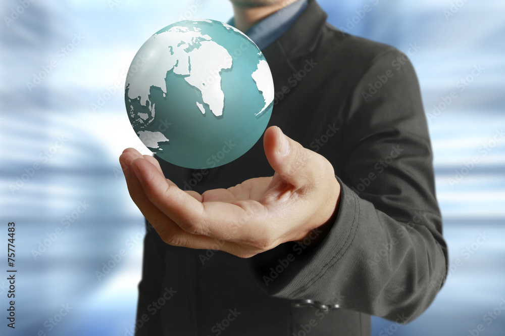 holding a glowing earth globe in his hands. Earth image provided holding a glowing earth globe in his hands. Earth image provided