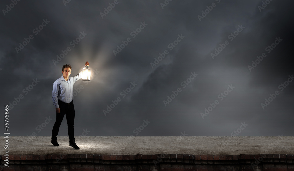Businessman in search in darkness