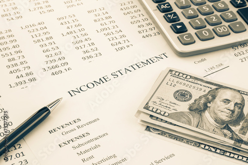 Money and income statement report in sepia tone