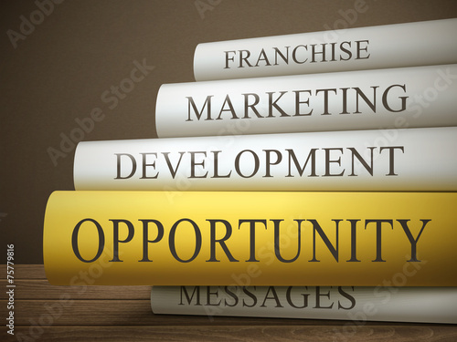 book title of opportunity isolated on a wooden table