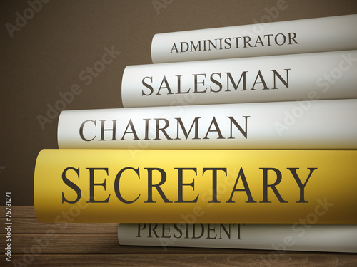 book title of secretary isolated on a wooden table