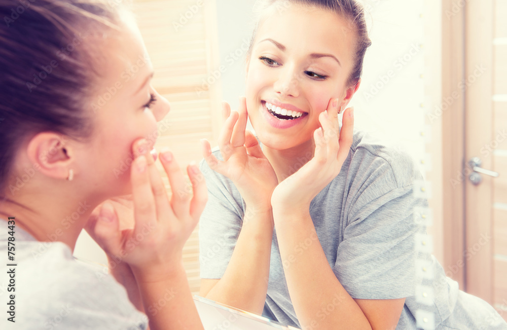 Skincare. Young beautiful teenage girl enjoying her clean skin Skincare. Young beautiful teenage girl enjoying her clean skin