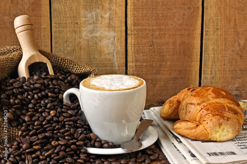 cappuccino  brioches and newspaper with background