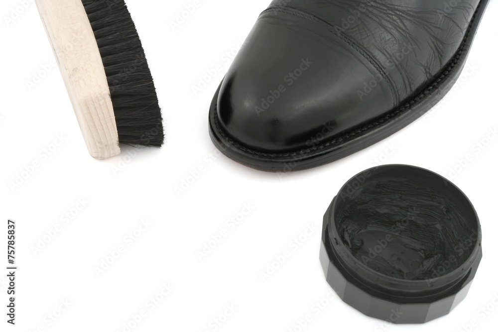 black leather shoe with brush and polish on white background black leather shoe with brush and polish on white background