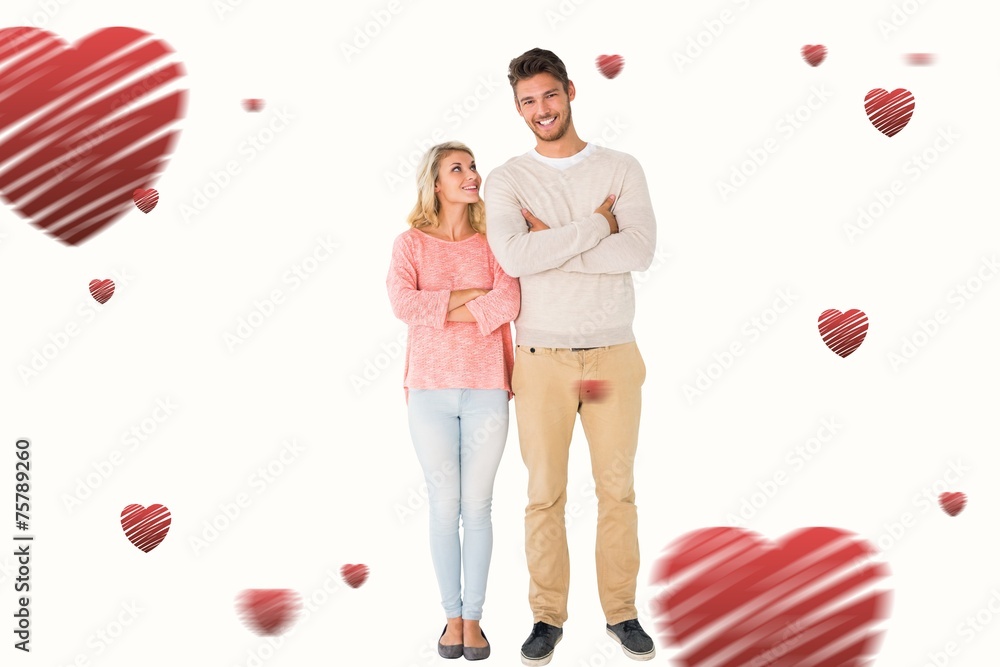Composite image of attractive couple smiling with arms crossed Composite image of attractive couple smiling with arms crossed