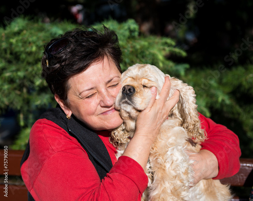 Fotografie Happy senior woman with american spaniel