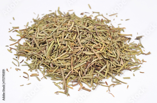 Heap of dried rosemary on a white