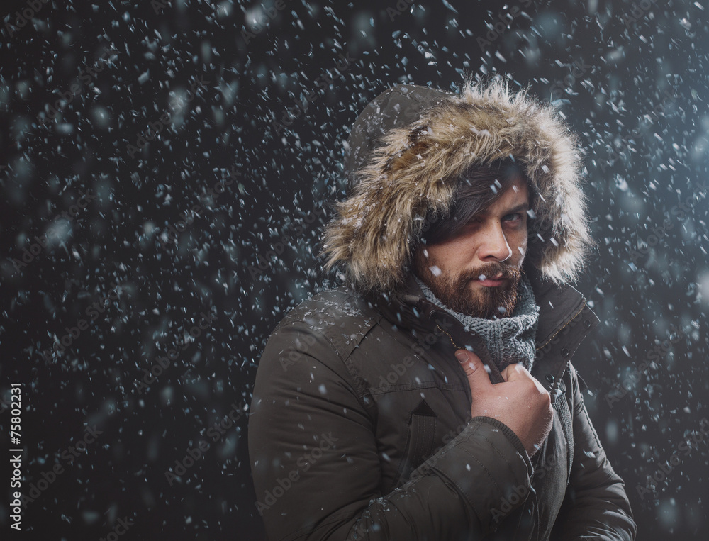 Handsome man in snow storm Handsome man in snow storm