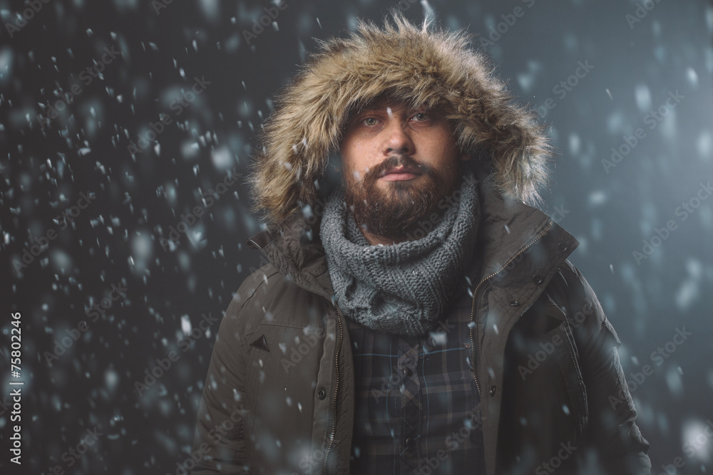 Handsome man in snow storm Handsome man in snow storm