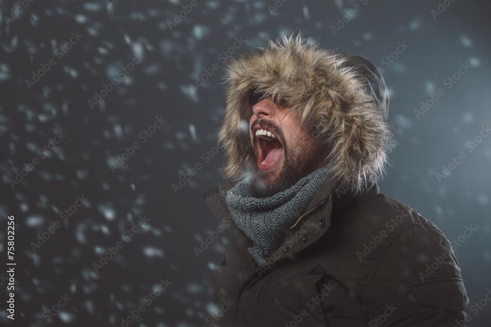 Handsome man in snow storm Handsome man in snow storm