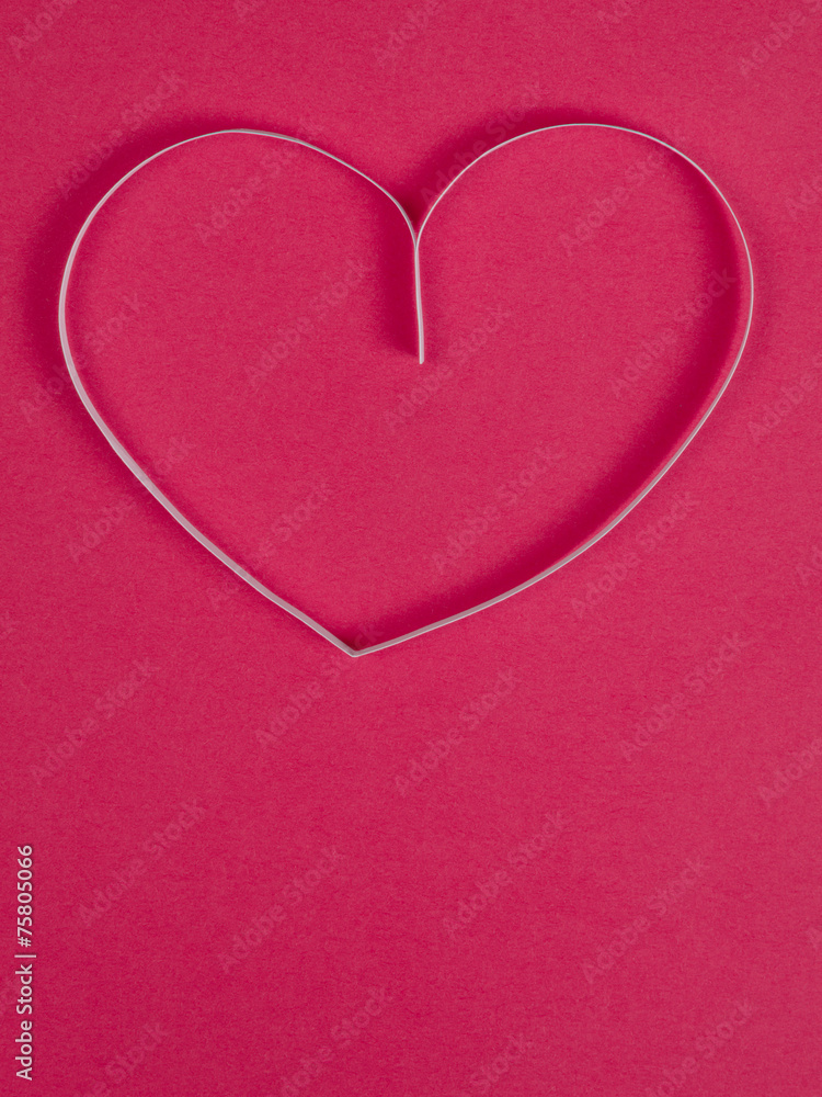 paper heart on pink paper background paper heart on pink paper background