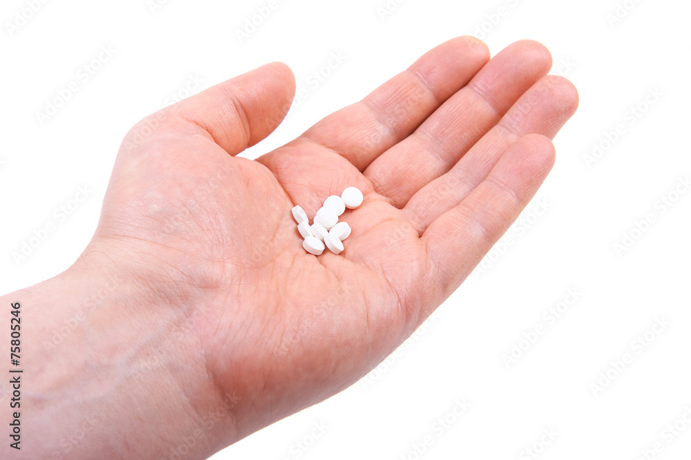 Hand holding pills. Isolated on white background Hand holding pills. Isolated on white background