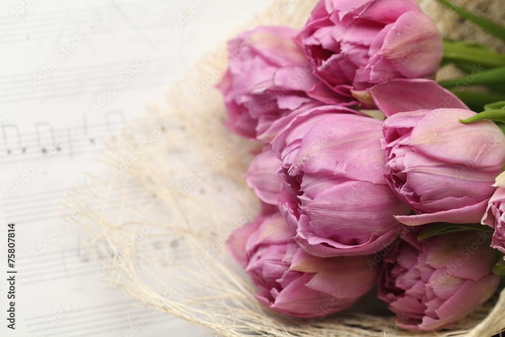 Beautiful tulip flowers on note paper background Beautiful tulip flowers on note paper background