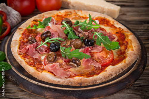 Delicious italian pizza served on wooden table