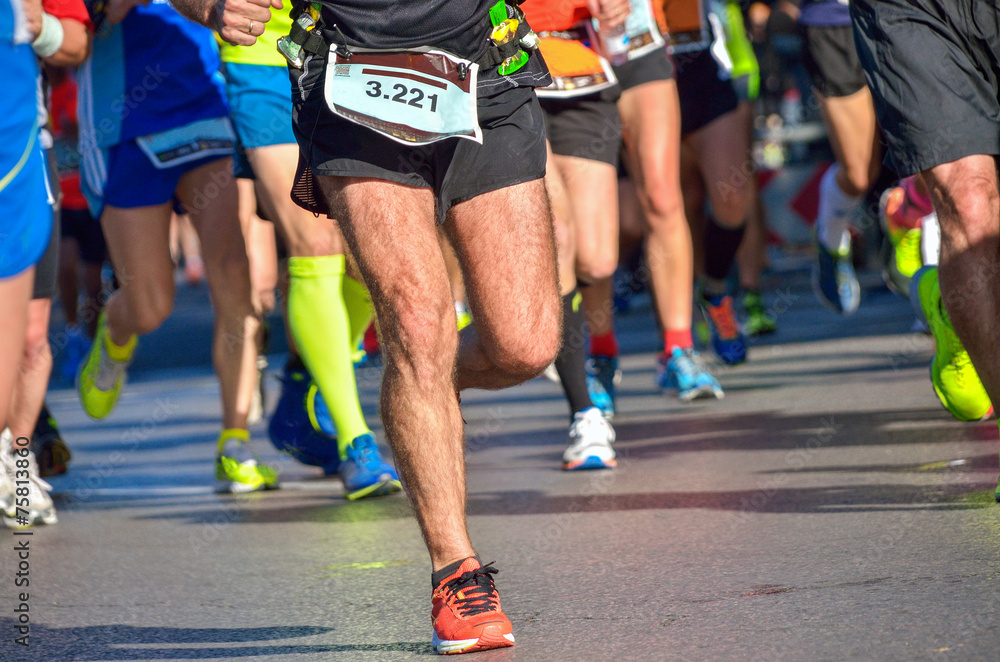 Marathon running race, people feet on road, sport concept Marathon running race, people feet on road, sport concept