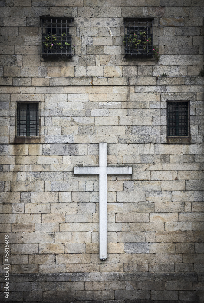 cross on a wall with windows