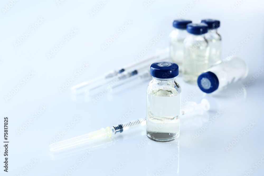 Vaccine in vial with syringe Vaccine in vial with syringe