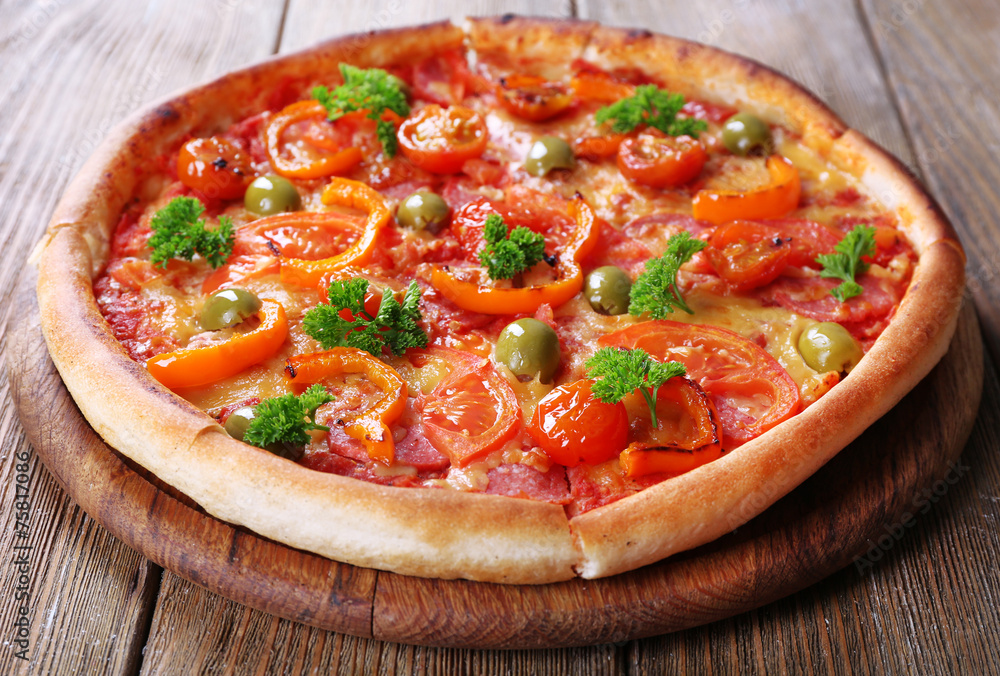 Tasty pizza with sausage and vegetables Tasty pizza with sausage and vegetables