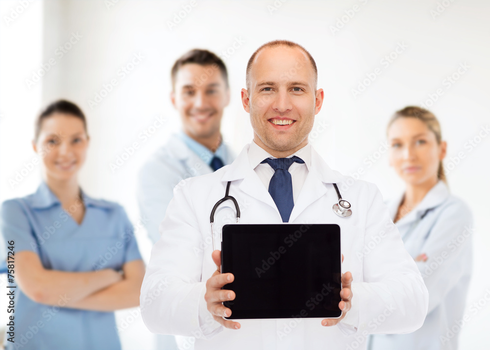 smiling male doctor with stethoscope and tablet pc smiling male doctor with stethoscope and tablet pc